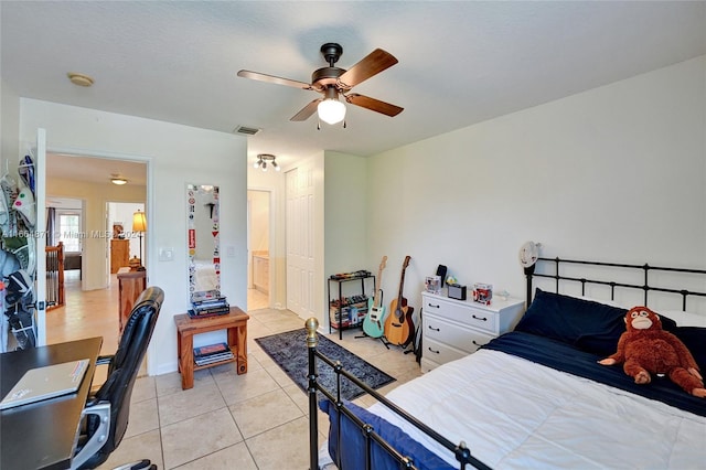 bedroom with light tile patterned flooring and ceiling fan