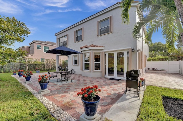 rear view of property with a patio and french doors