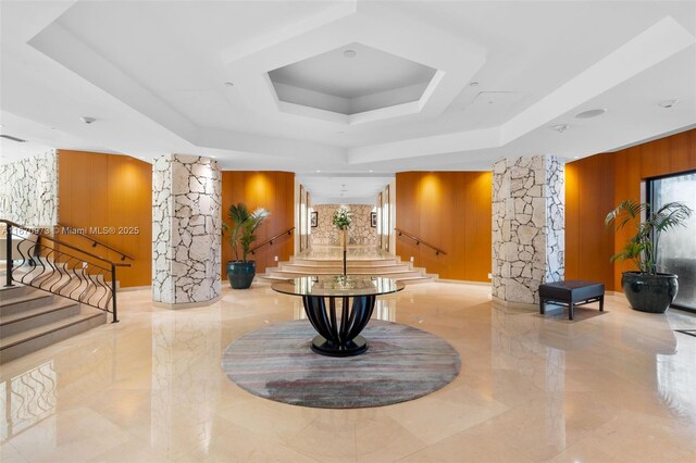 kitchen with sink, light hardwood / wood-style flooring, appliances with stainless steel finishes, white cabinetry, and light stone counters