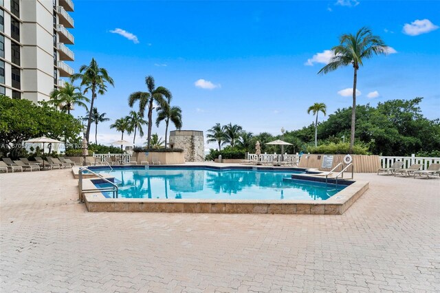 view of swimming pool featuring a gazebo and a patio area