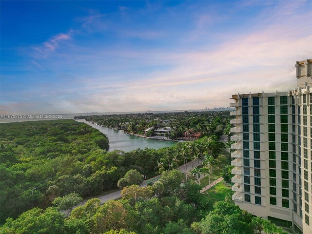 outdoor building at dusk featuring a water view