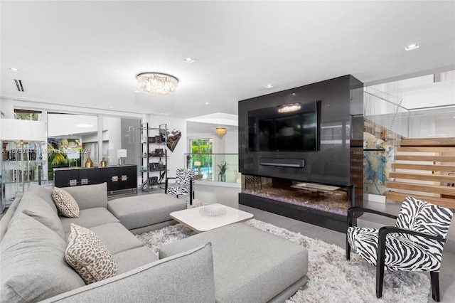 living room featuring an inviting chandelier