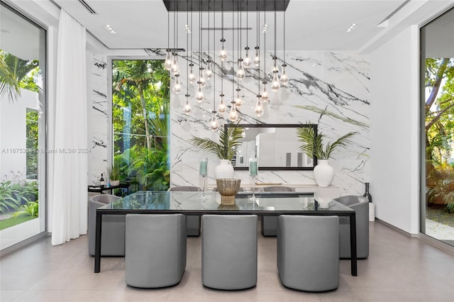 dining area with an inviting chandelier