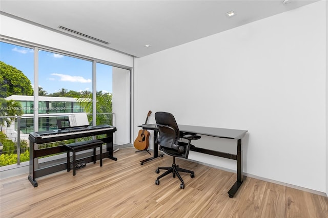 office with light hardwood / wood-style floors