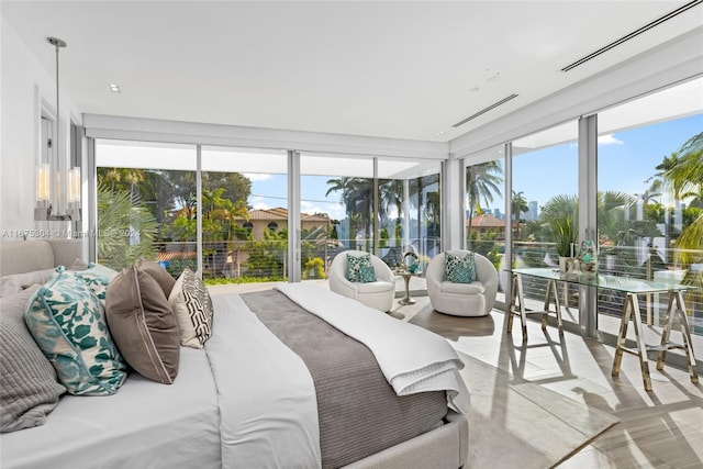 bedroom featuring floor to ceiling windows