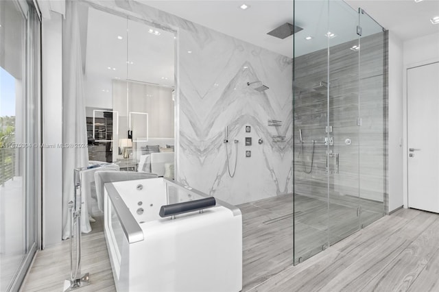 bathroom featuring wood-type flooring and plus walk in shower