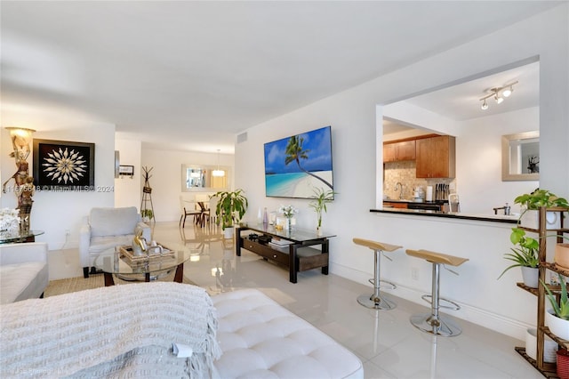 tiled living room with sink