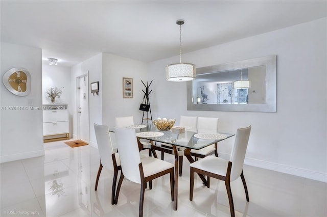 dining area featuring light tile patterned floors