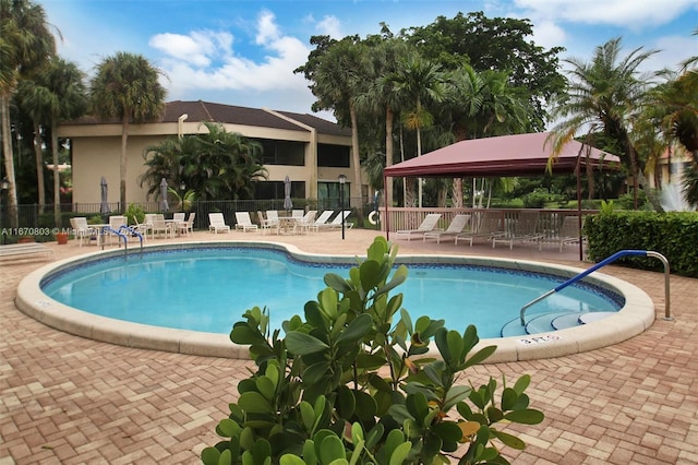 view of pool featuring a gazebo and a patio