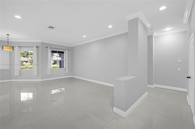 unfurnished room featuring ornamental molding and light tile patterned floors