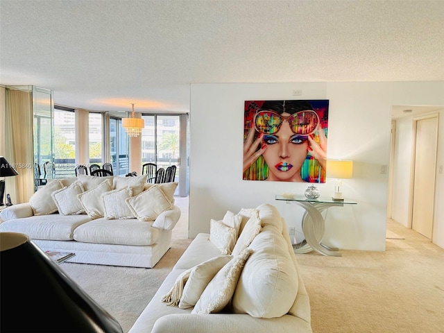 living room with light carpet, a wall of windows, and a textured ceiling