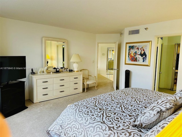 bedroom featuring light colored carpet