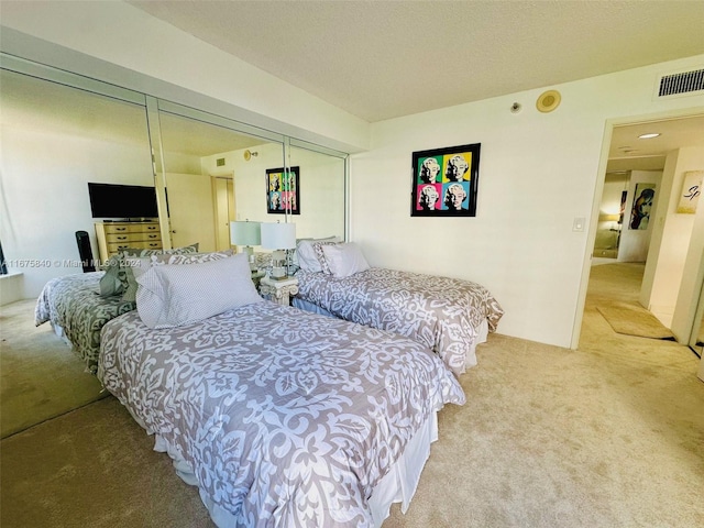 carpeted bedroom featuring a closet