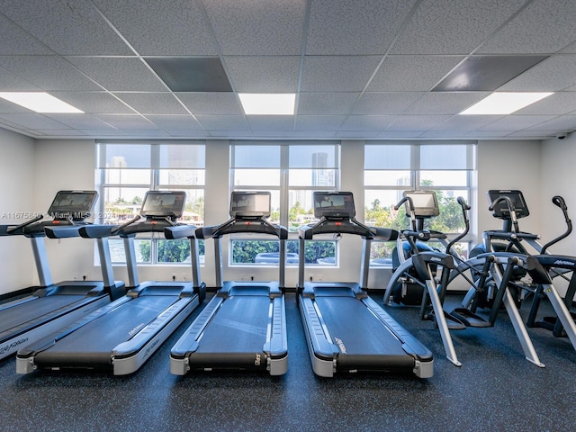 workout area featuring a drop ceiling