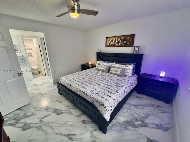 bedroom featuring ensuite bathroom and ceiling fan