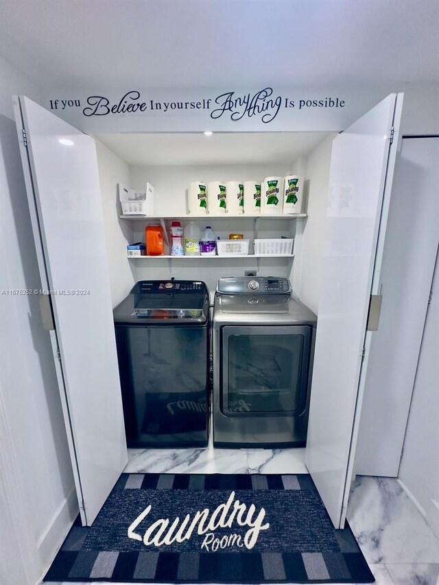 laundry room featuring separate washer and dryer