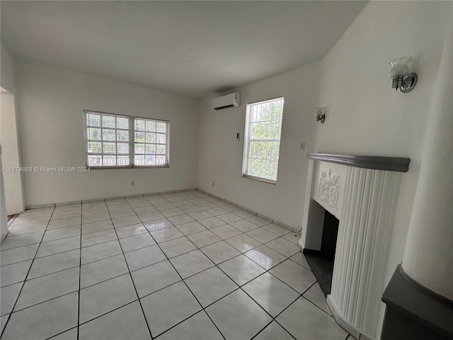 unfurnished living room with light tile patterned flooring and a wall mounted air conditioner