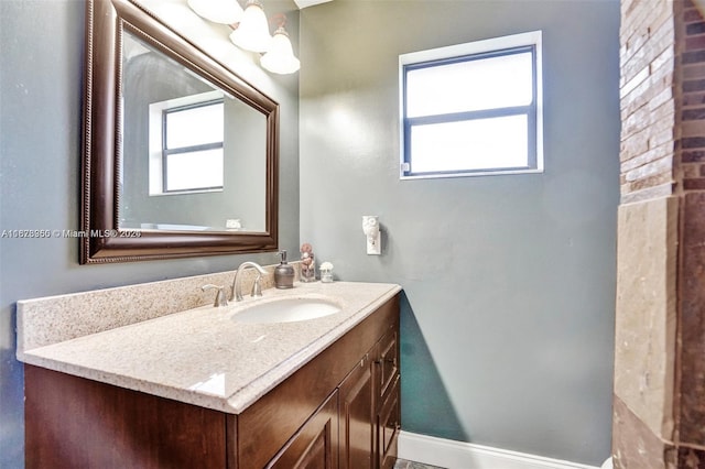 bathroom featuring vanity and a wealth of natural light