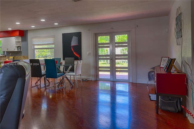 dining room featuring plenty of natural light, french doors, and wood-type flooring