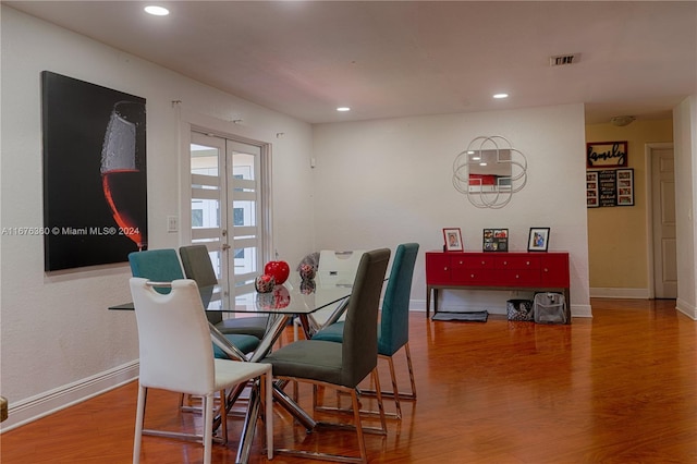 dining room featuring french doors and hardwood / wood-style floors