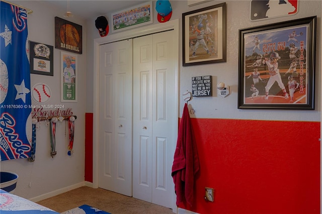 carpeted bedroom with a closet