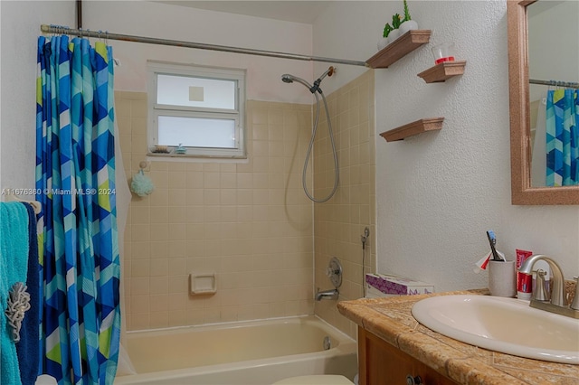 bathroom with shower / tub combo and vanity