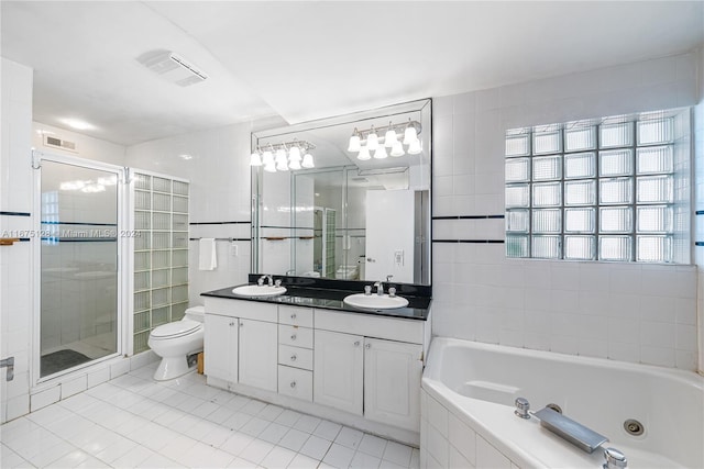 full bathroom featuring tile patterned floors, plenty of natural light, shower with separate bathtub, and vanity