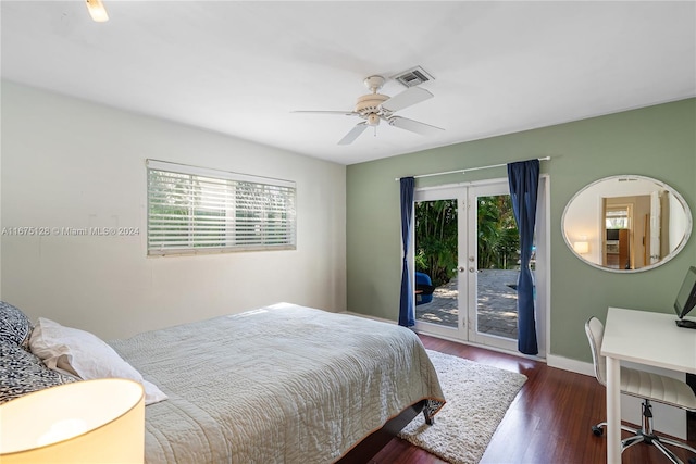 bedroom with access to exterior, multiple windows, dark wood-type flooring, and ceiling fan