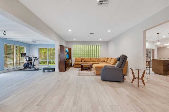 bedroom with wood-type flooring and track lighting