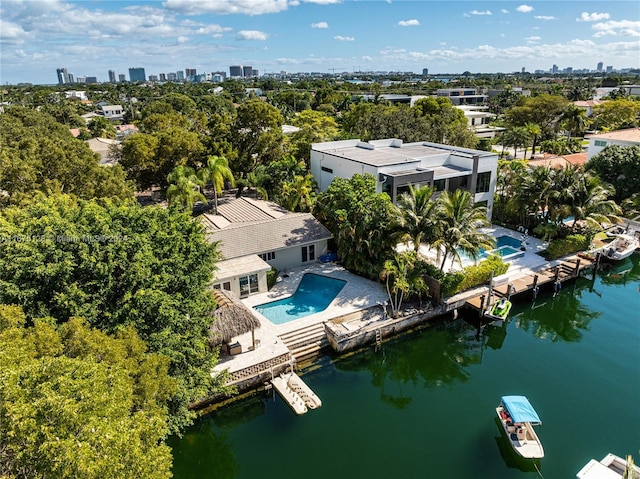 birds eye view of property with a water view