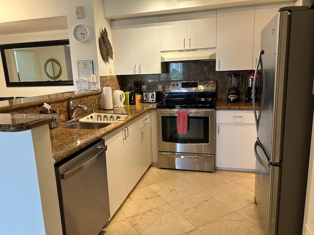 kitchen featuring appliances with stainless steel finishes, sink, and white cabinetry