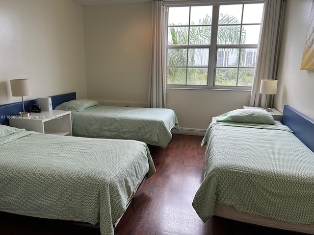 bedroom featuring dark hardwood / wood-style flooring