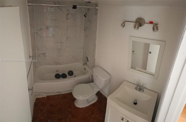 full bathroom with vanity, tile patterned flooring, toilet, and tiled shower / bath combo