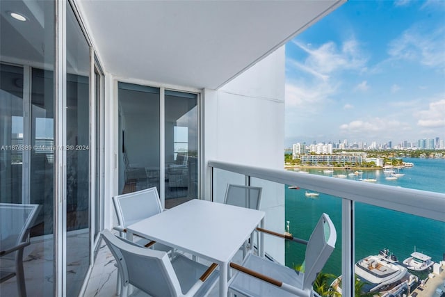 balcony featuring a water view