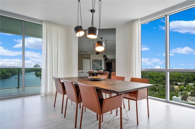 dining space featuring a water view