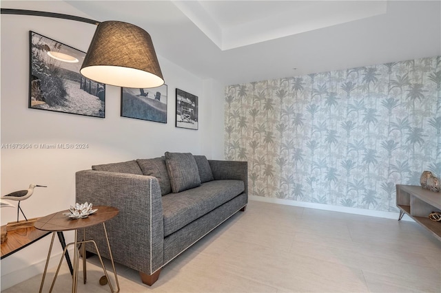 living room featuring a raised ceiling