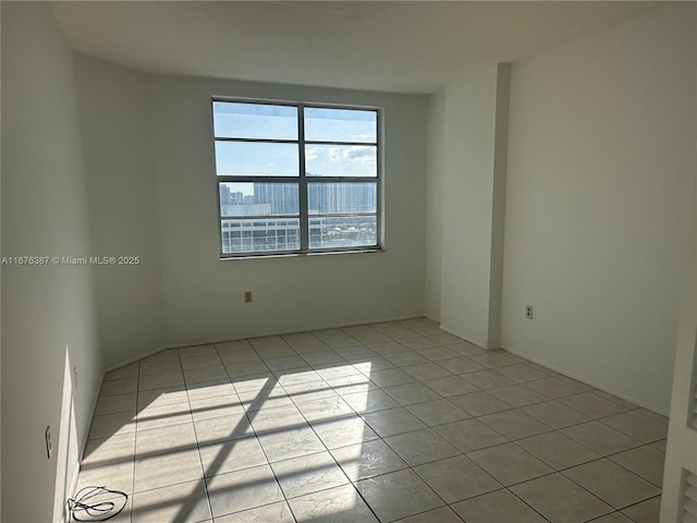 empty room with light tile patterned floors