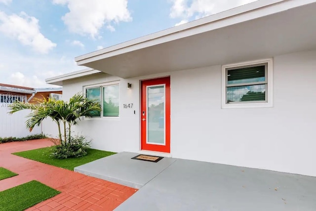 entrance to property featuring a patio area