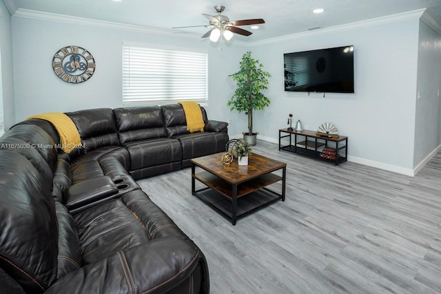 living room featuring ornamental molding, ceiling fan, and light hardwood / wood-style floors