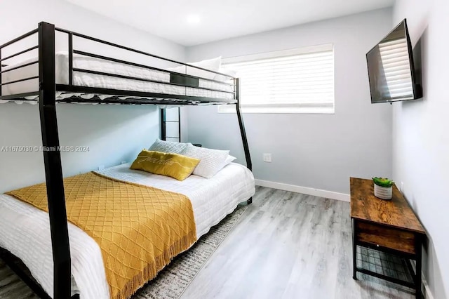 bedroom featuring wood-type flooring