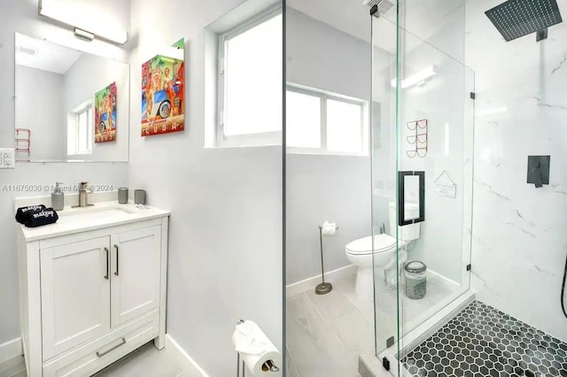 bathroom with vanity, toilet, an enclosed shower, and tile patterned floors