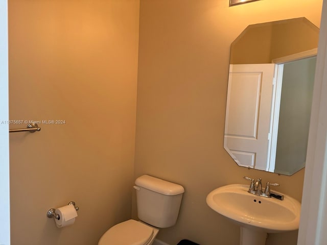 bathroom with toilet and sink