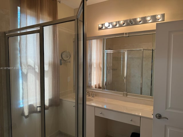 bathroom featuring vanity and an enclosed shower