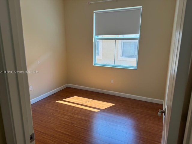 spare room featuring hardwood / wood-style flooring