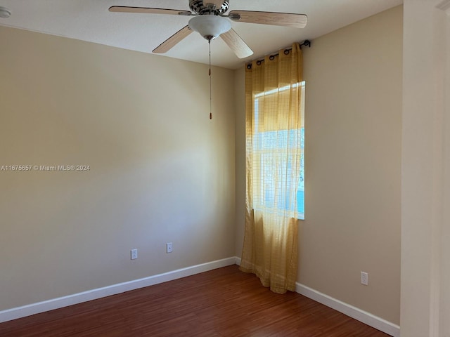 empty room with hardwood / wood-style floors and ceiling fan