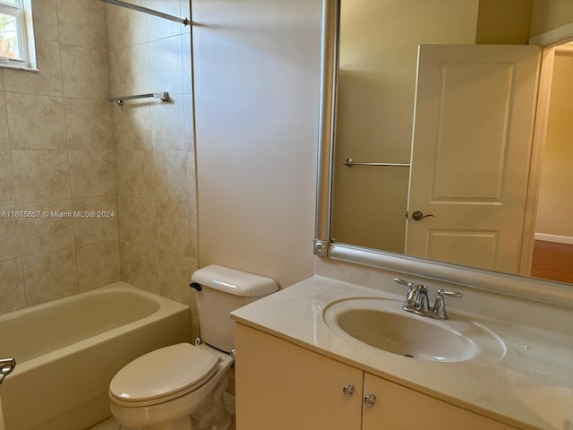 full bathroom with vanity, toilet, and tiled shower / bath combo