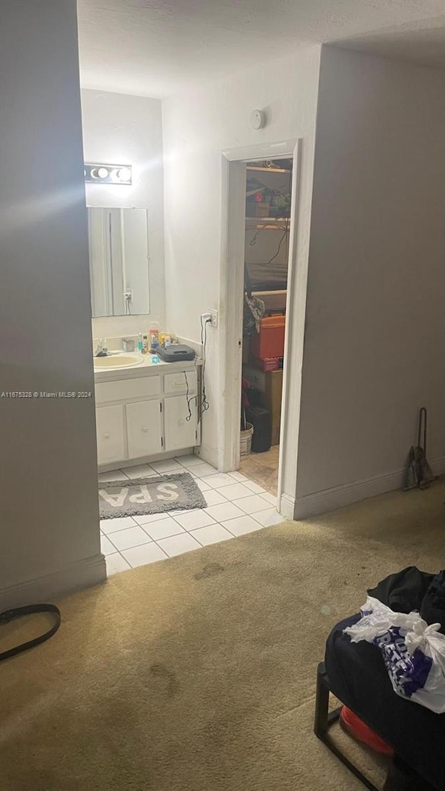 bathroom with tile patterned floors and vanity