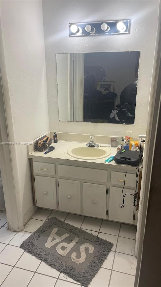 bathroom with vanity and tile patterned floors