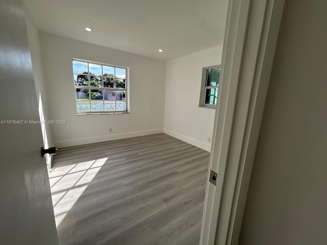 spare room with light wood-type flooring