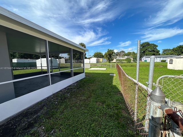 view of yard with a sunroom